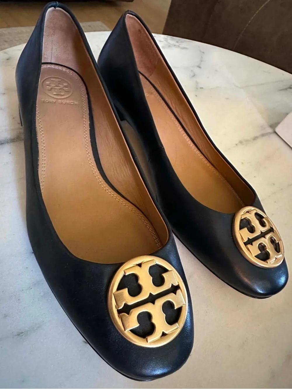 Tory Burch Black Leather Flats with Gold Logo  Contact me at: 985-758-9360